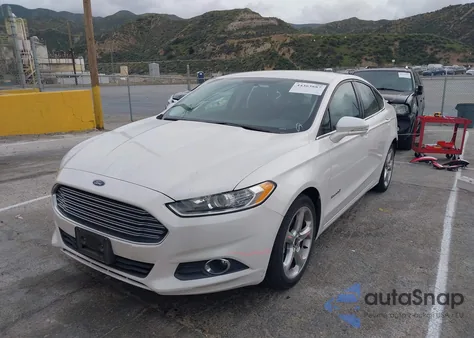2014 Ford Fusion Hybrid Se z USA, uszkodzony, nr VIN 3FA6P0LUXER356571